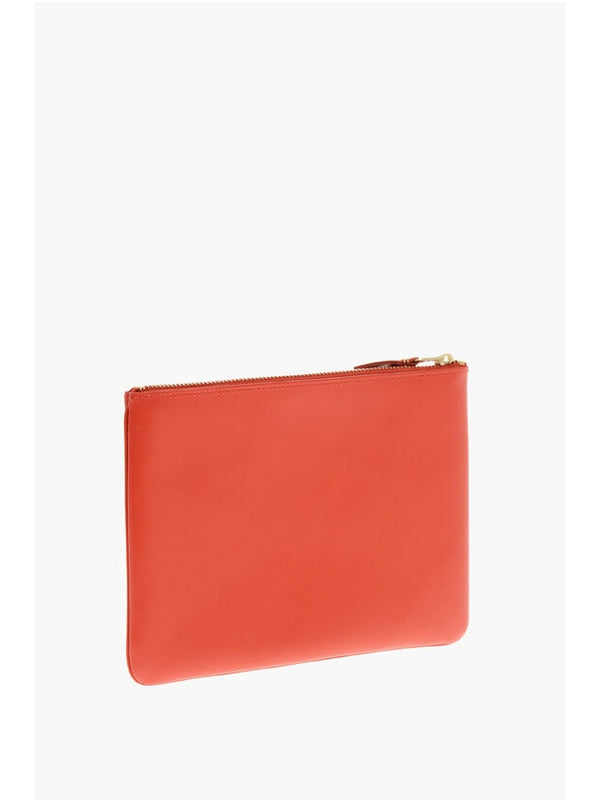 Comme Des Garcons Orange Clutch Bags