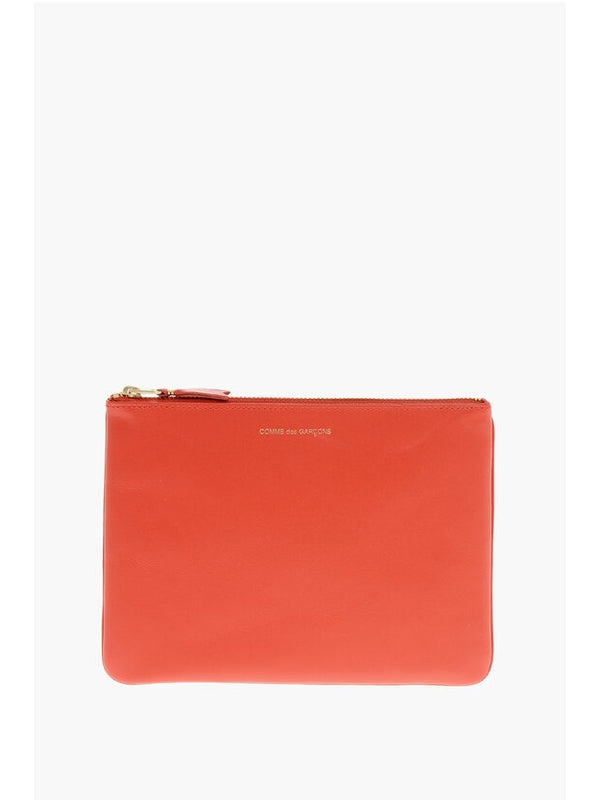 Comme Des Garcons Orange Clutch Bags