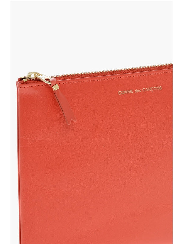 Comme Des Garcons Orange Clutch Bags